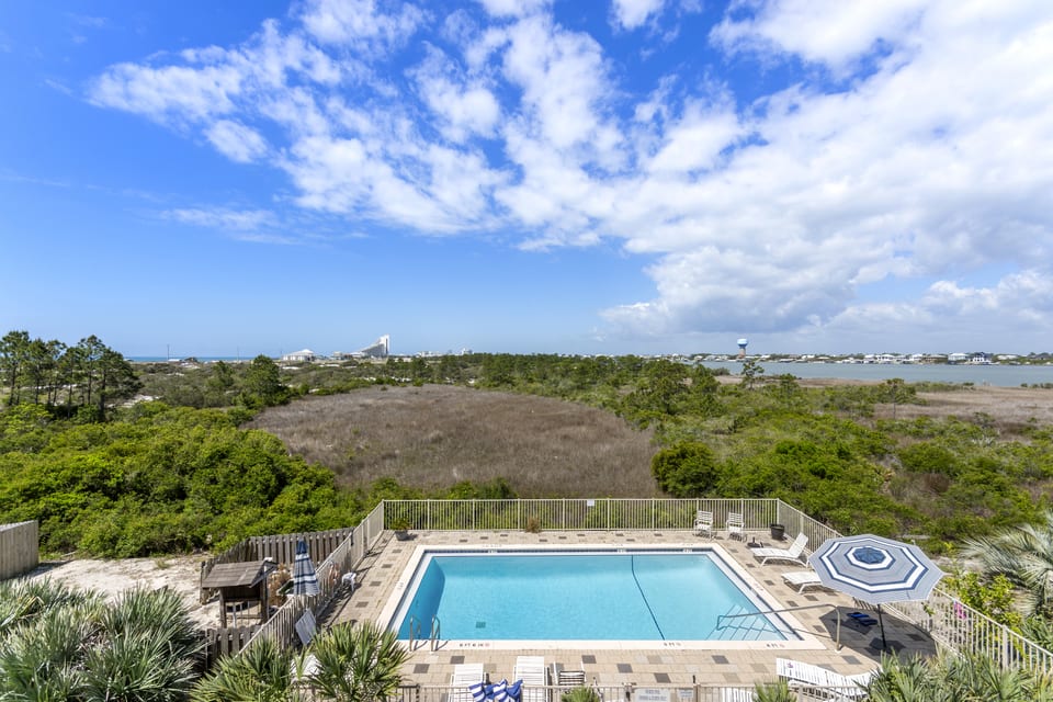 Looking down over the guest pool, the preserve and the water beyond