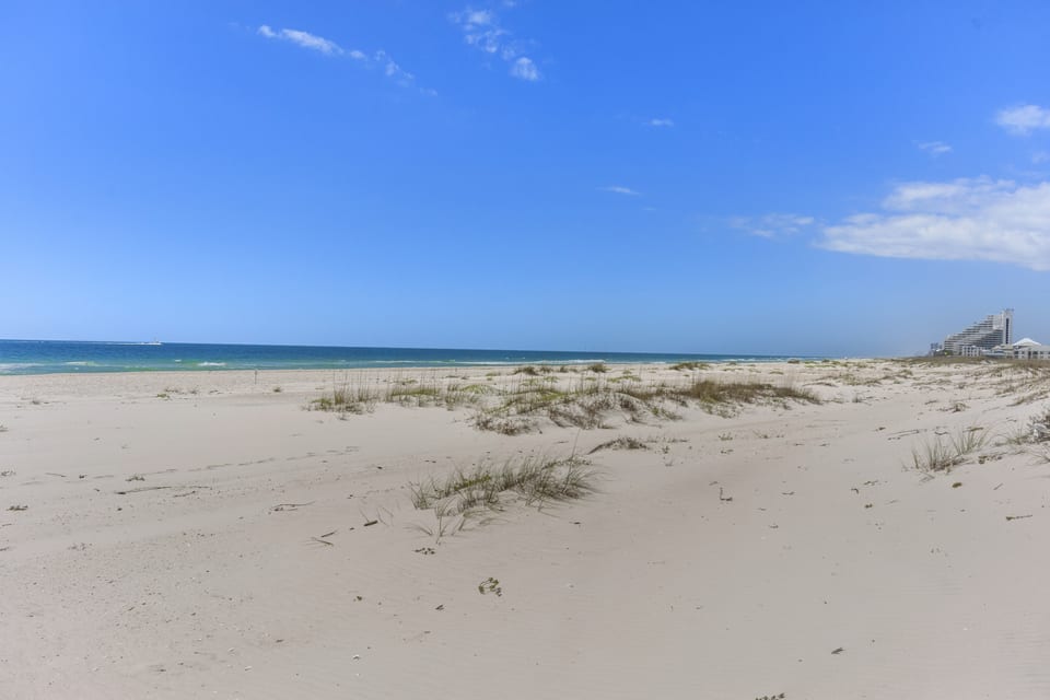 The wide, quiet beach at the end of the boardwalk