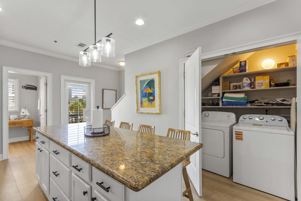 Island seating with the laundry alcove behind